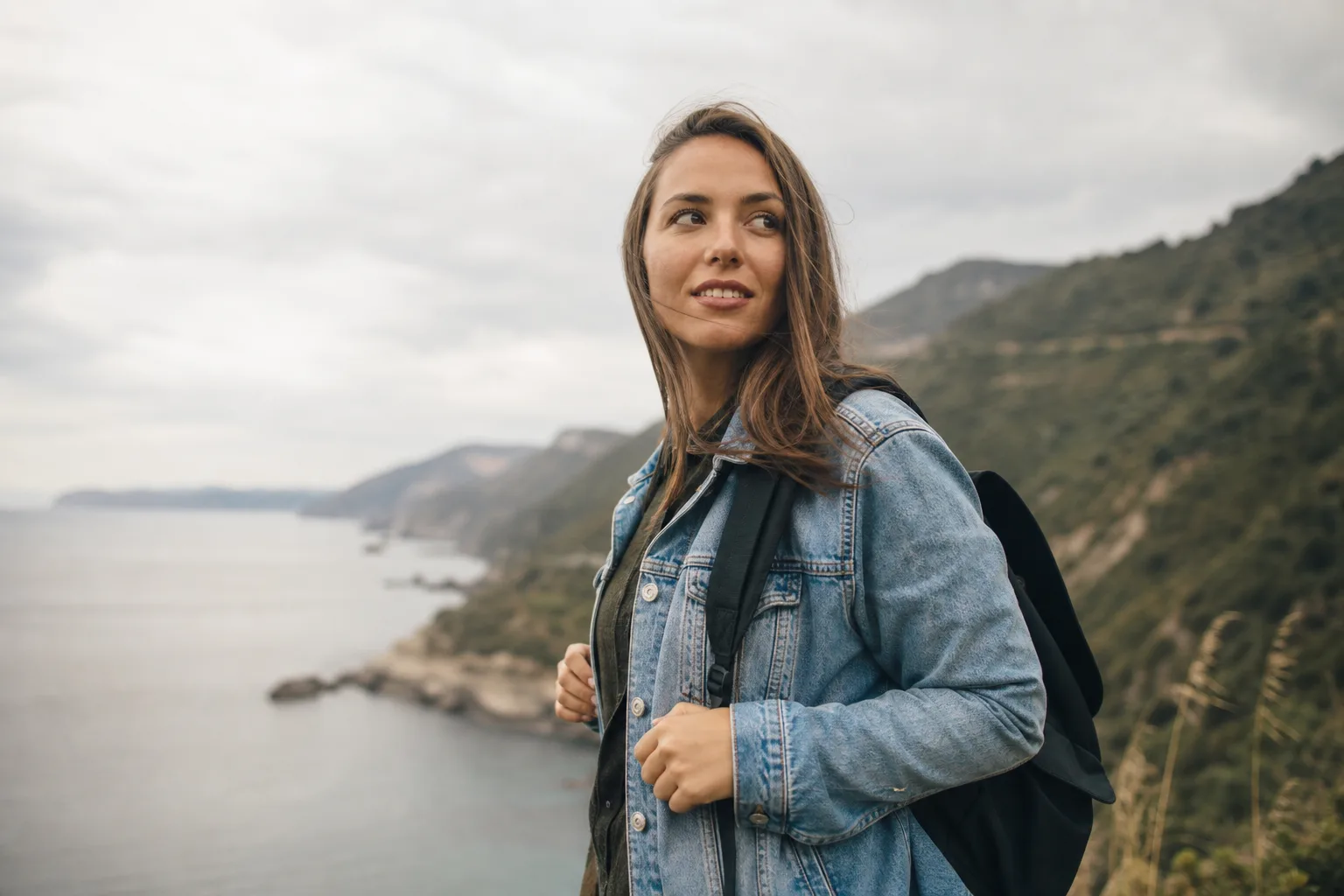 person wearing blue denim jacket