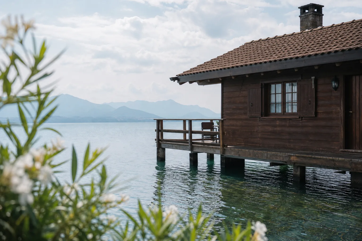brown wooden cottage on blue body of water during daytime