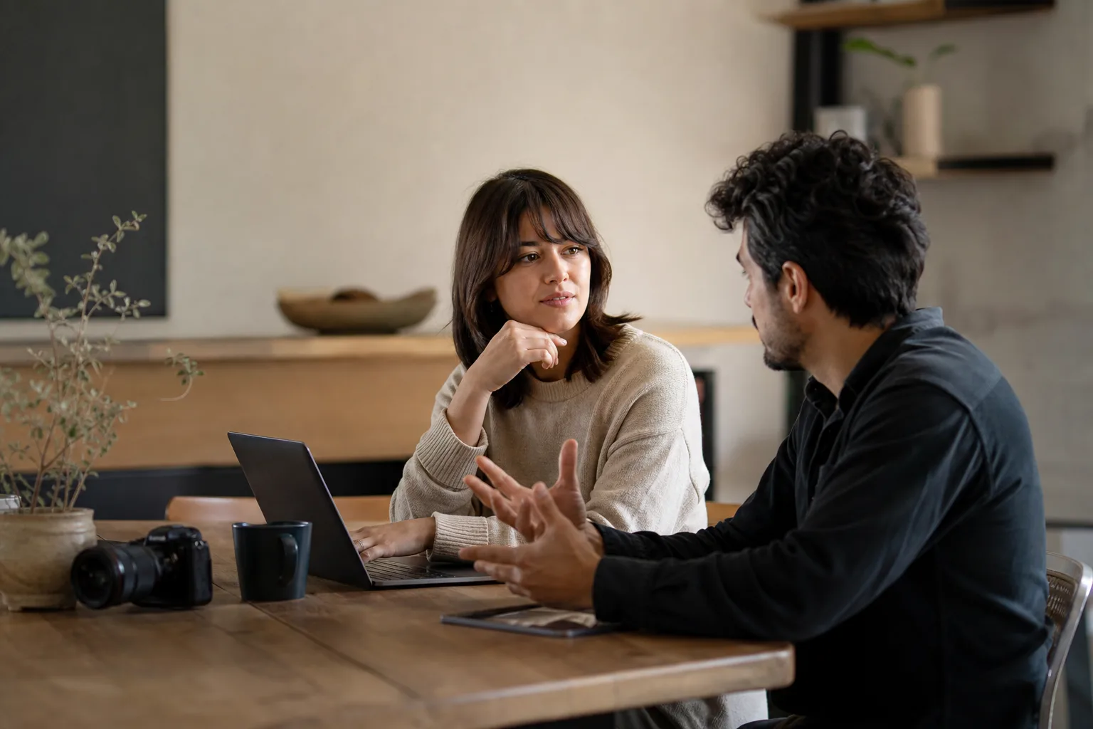 selective focus photography of people sits in front of table inside room